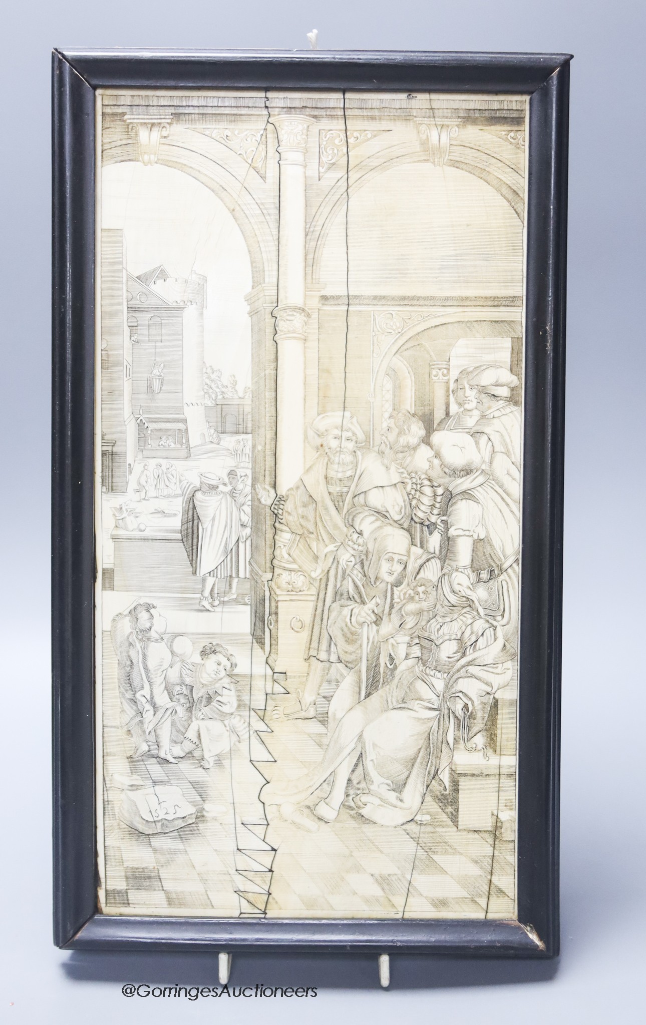 A 19th century engraved and sepia-stained ivory plaque with interior scene, width 18cm height 36cm